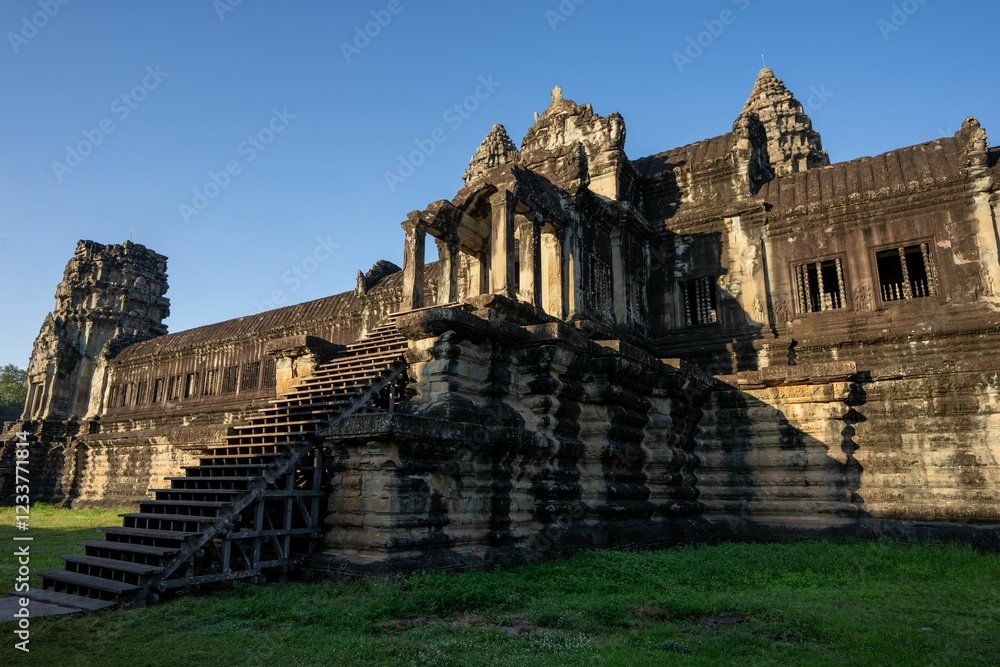 Fototapeta premium Angkor Wat temple in Cambodia under a clear blue sky.