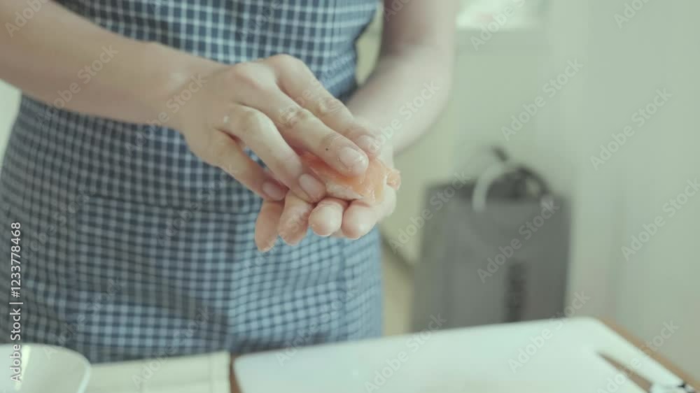 A close-up of a person's hands working with fresh ingredients in a kitchen setting, showcasing the process of cooking and meal preparation. A close-up of a person's hands working with fresh ingredients in a kitchen setting, showcasing the process of cooking and meal preparation.