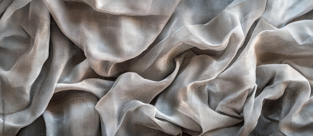 Obraz premium Gray silk fabric folded and wrinkled texture with soft sheen and natural flow Copy Space
