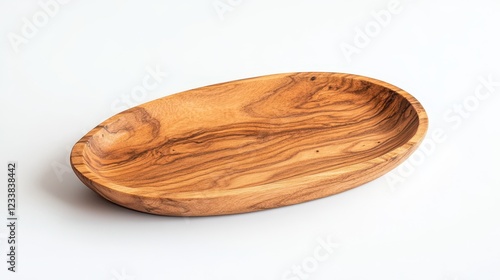 Oval wooden tray showcasing natural grain patterns, set against a white background. photo