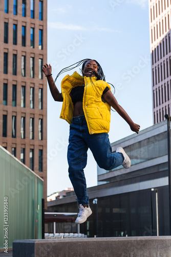 Happy ethnic woman smiling and jumping