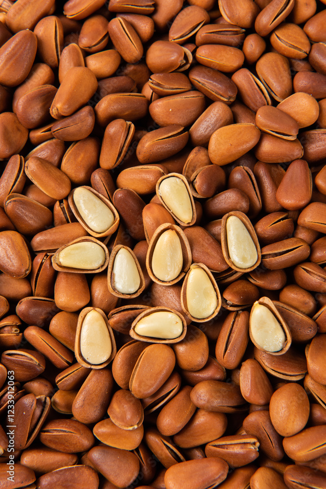 close up of roasted pine nuts background close up of roasted pine nuts background