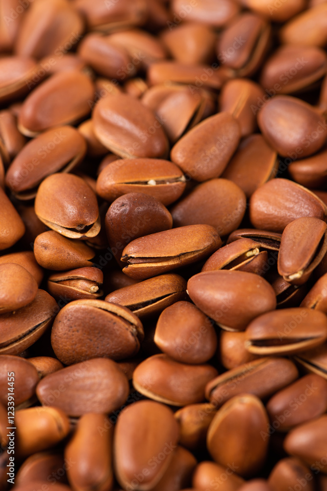 close up of roasted pine nuts background close up of roasted pine nuts background