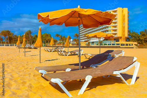 Obraz na płótnie Sandy beach with sun loungers and umbrellas set w salonie