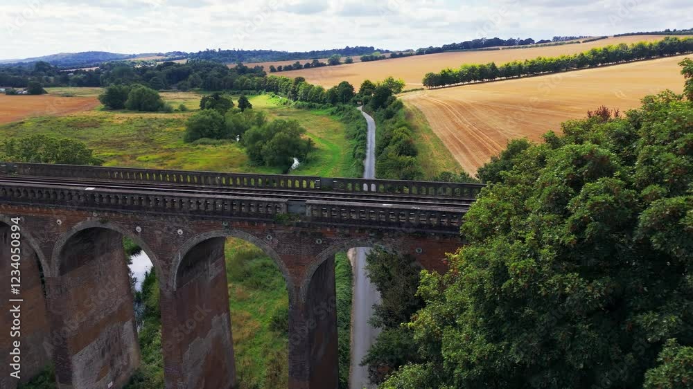 Aerial dolly reveal, arched bridge structure, countryside scenery Aerial dolly reveal, arched bridge structure, countryside scenery