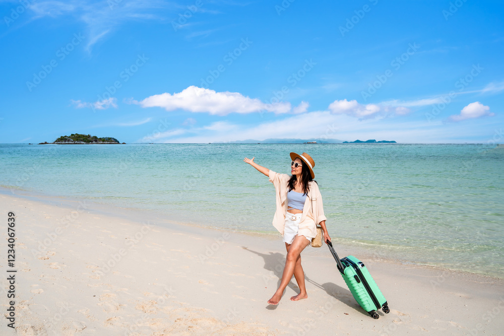 Young woman traveler with luggage relaxing and enjoying at beautiful tropical sand beach, Summer vacation and Travel concept Young woman traveler with luggage relaxing and enjoying at beautiful tropical sand beach, Summer vacation and Travel concept
