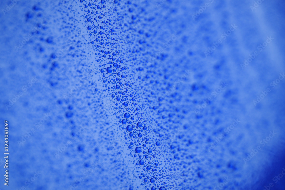 Obraz premium Closeup blue car paint surface with hydrophobic ceramic coating