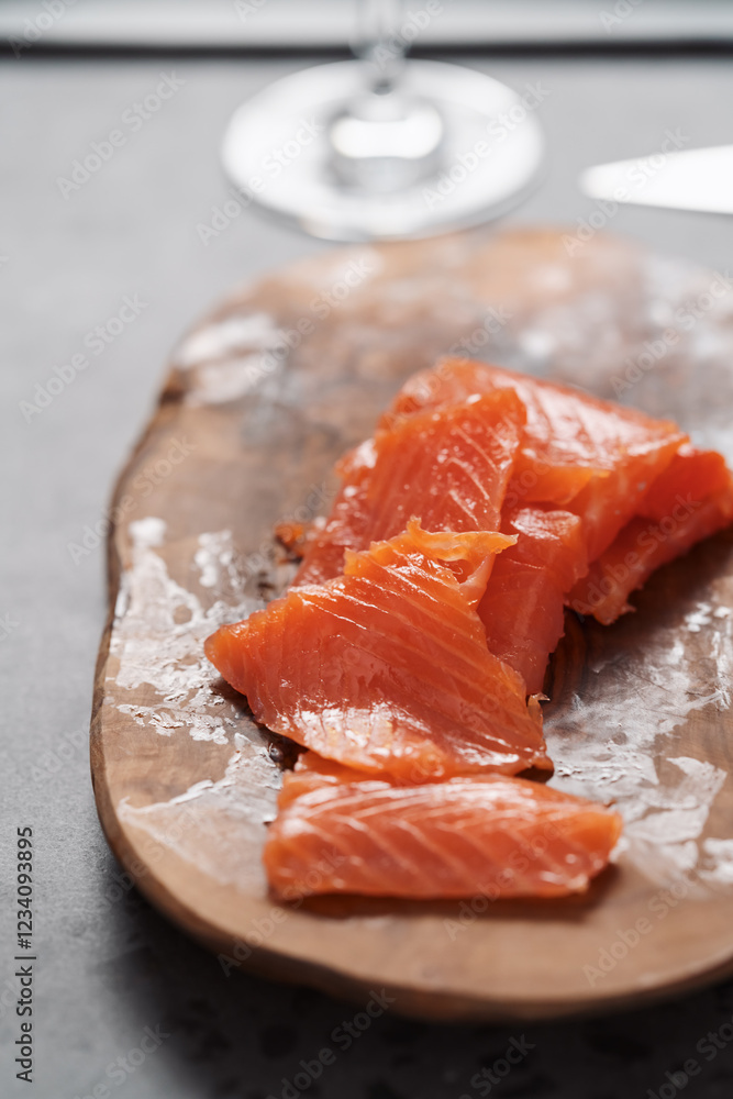 Smoked salted salmon slices on wood board Smoked salted salmon slices on wood board