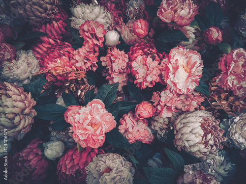 Wallpaper Mural A lush arrangement of pink, red, and white flowers.  Dark green foliage provides a rich backdrop. Hints of sparkle and metallic accents add a touch of glamour. Torontodigital.ca