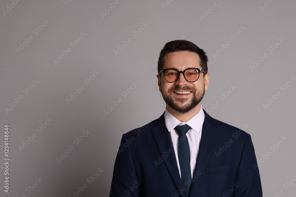 Portrait of banker in glasses on grey background, space for text Portrait of banker in glasses on grey background, space for text