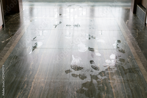 Shoe prints on the wet floor