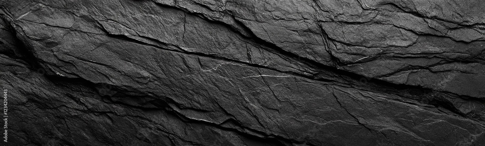 Black white rock texture. Rough mountain surface. Close-up. Dark gray stone background with space for design. Web banner. Wide.