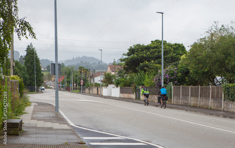 MTB cyclists on route crossing a rural town