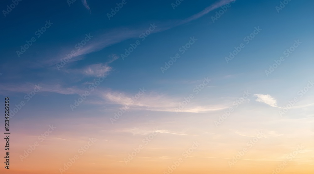 Obraz premium The Serene Sky at Dusk is adorned with Soft, Dreamy Clouds that create a tranquil atmosphere