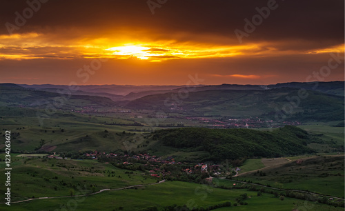 Obraz na płótnie Aerial view of the lush green hills of Transylvania during sunset, showcasing the natural beauty and untouched landscapes of this Romanian region. Travel to Romania. w salonie