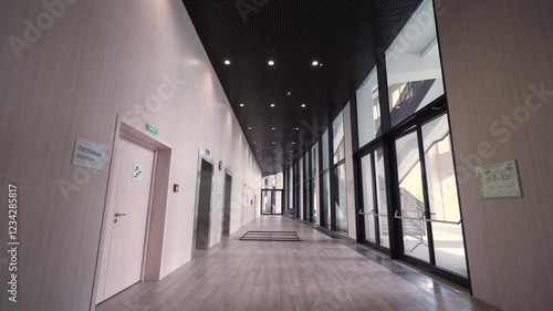 Long corridor with curved windows. Dolly camera shot