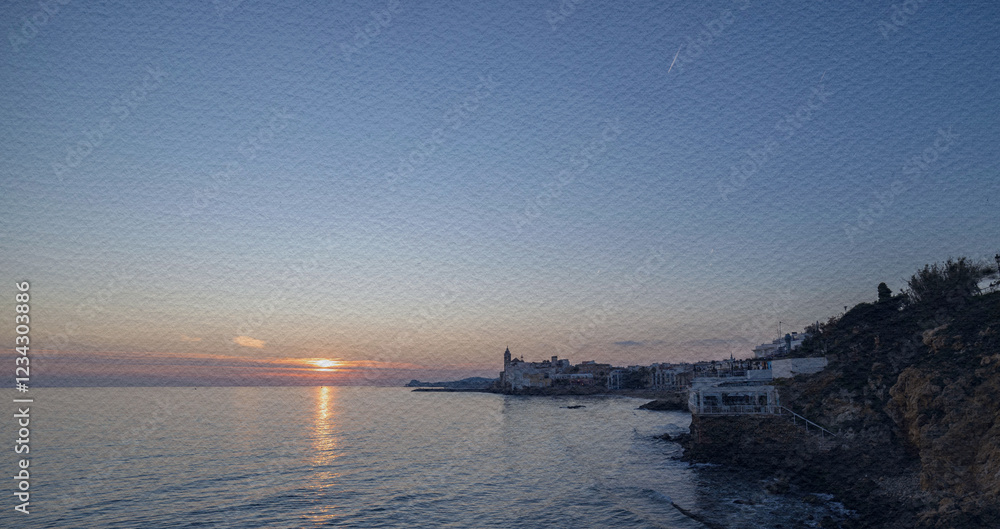 Beautiful sunset over the ocean with a small town in the background Beautiful sunset over the ocean with a small town in the background