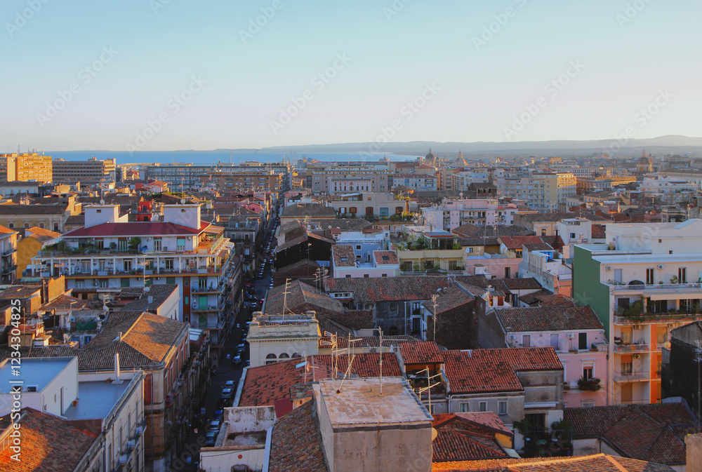 City on seashore at sunset. Catania, Sicily, Italy