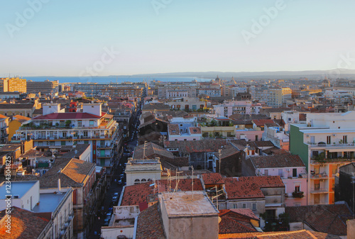 Obraz na płótnie City on seashore at sunset. Catania, Sicily, Italy w salonie