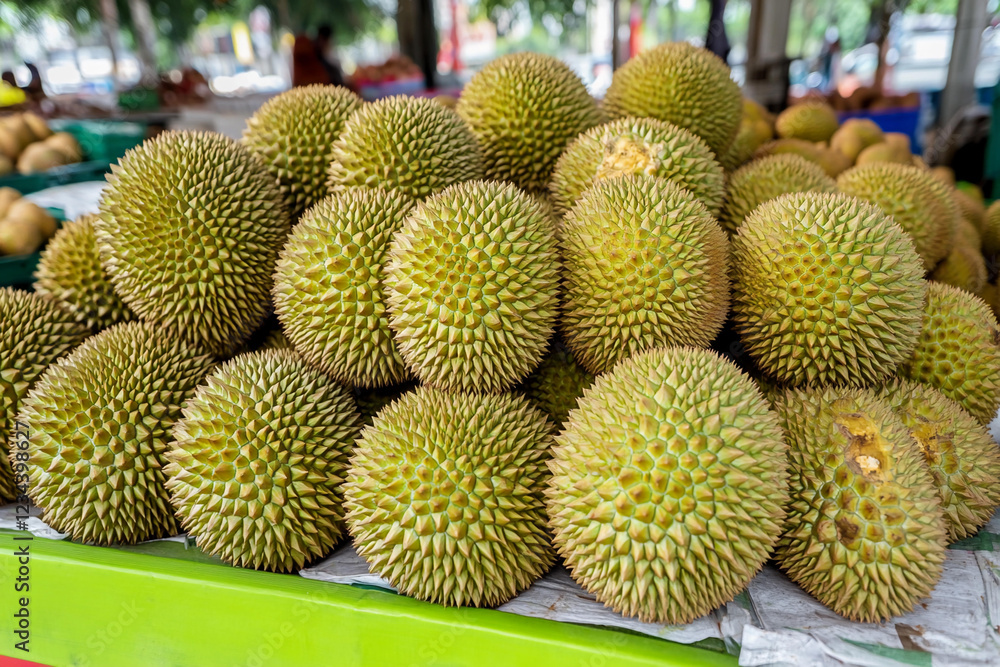 Freshly harvested durians in a vibrant marketplace Freshly harvested durians in a vibrant marketplace