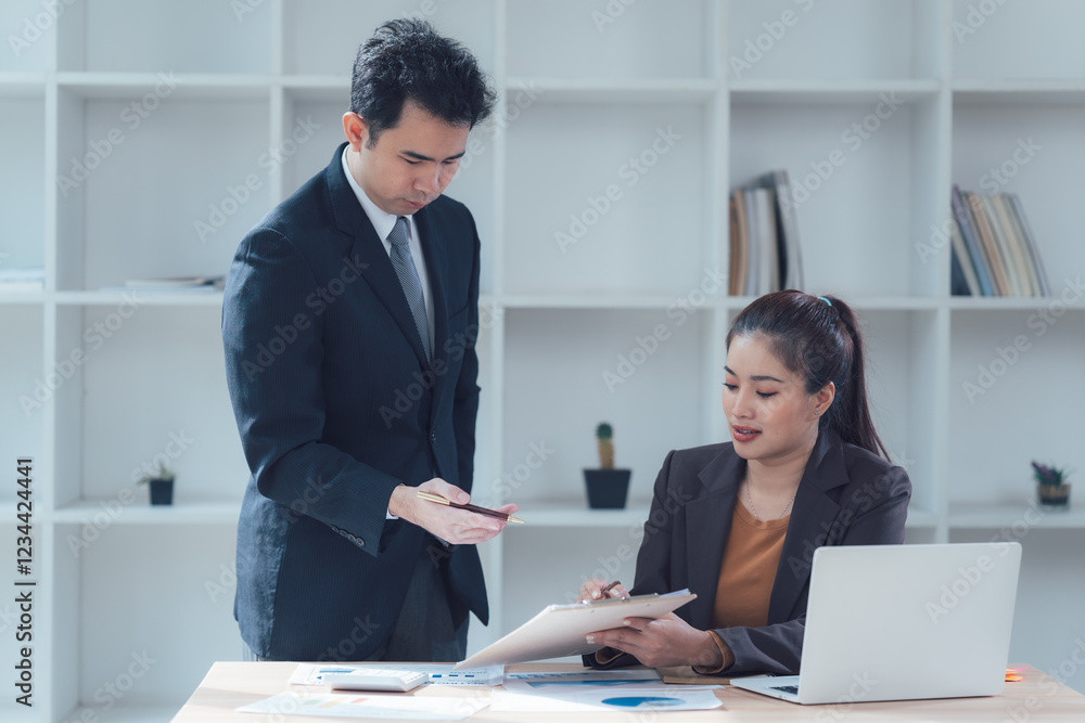 Business Collaboration: A professional setting showcasing a focused meeting between a male and female colleague, emphasizing teamwork, communication, and collaborative problem-solving. Business Collaboration: A professional setting showcasing a focused meeting between a male and female colleague, emphasizing teamwork, communication, and collaborative problem-solving.