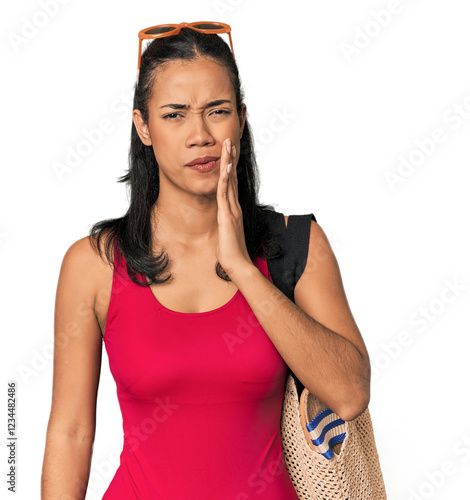 Cuadro en lienzo Young Filipina with beach bag having a strong teeth pain, molar ache