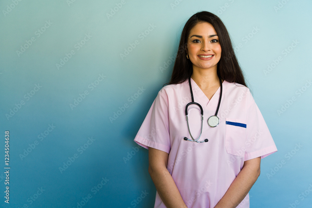 Portrait of smiling hispanic female doctor or nurse posing with stethoscope Portrait of smiling hispanic female doctor or nurse posing with stethoscope