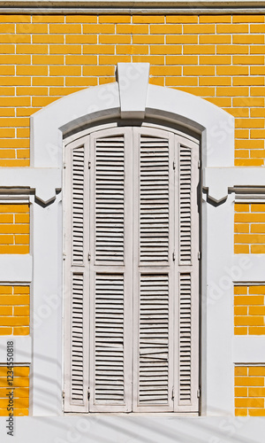Obraz na płótnie Ancient window on yellow facade in Petropolis, Rio de Janeiro, Brazil w salonie