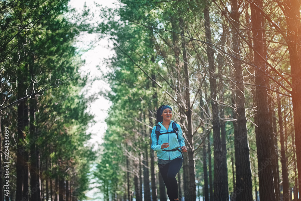 Trees, running and woman in forest with fitness, wellness and challenge on morning workout. Nature, healthy exercise and girl in woods for outdoor marathon, endurance training and resilience in park Trees, running and woman in forest with fitness, wellness and challenge on morning workout. Nature, healthy exercise and girl in woods for outdoor marathon, endurance training and resilience in park
