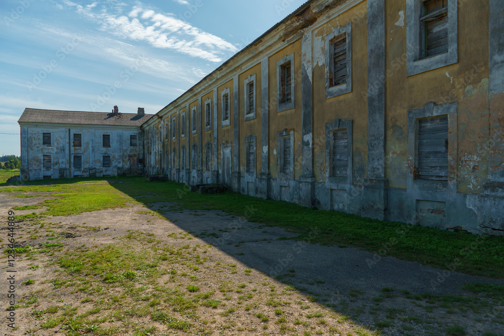 An abandoned old manor. Destroyed walls and roof of a private country house. An abandoned old manor. Destroyed walls and roof of a private country house.