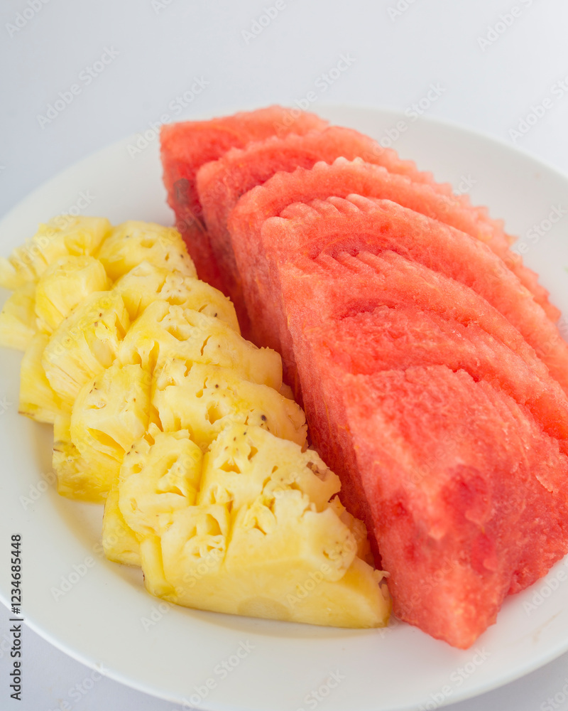Fresh Watermelon and Pineapple Slices on a White Plate Fresh Watermelon and Pineapple Slices on a White Plate