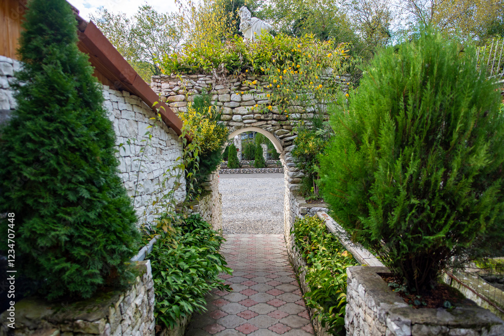 Naklejka premium Traditional chalet with a rest area and a bar for tourists to visit when climbing a mountain gorge. Foothills of the Caucasus, Abkhazia