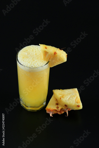fresh pineapple juice with sliced pineapple pieces 