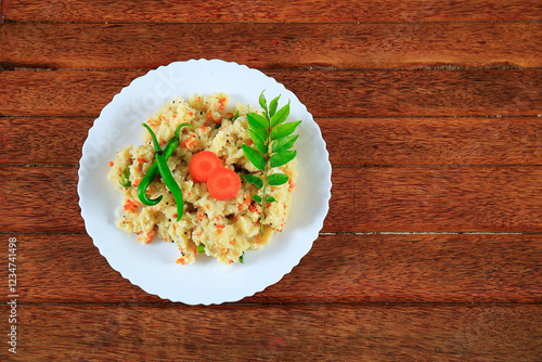 south indian breakfast upma isolated on wooden background