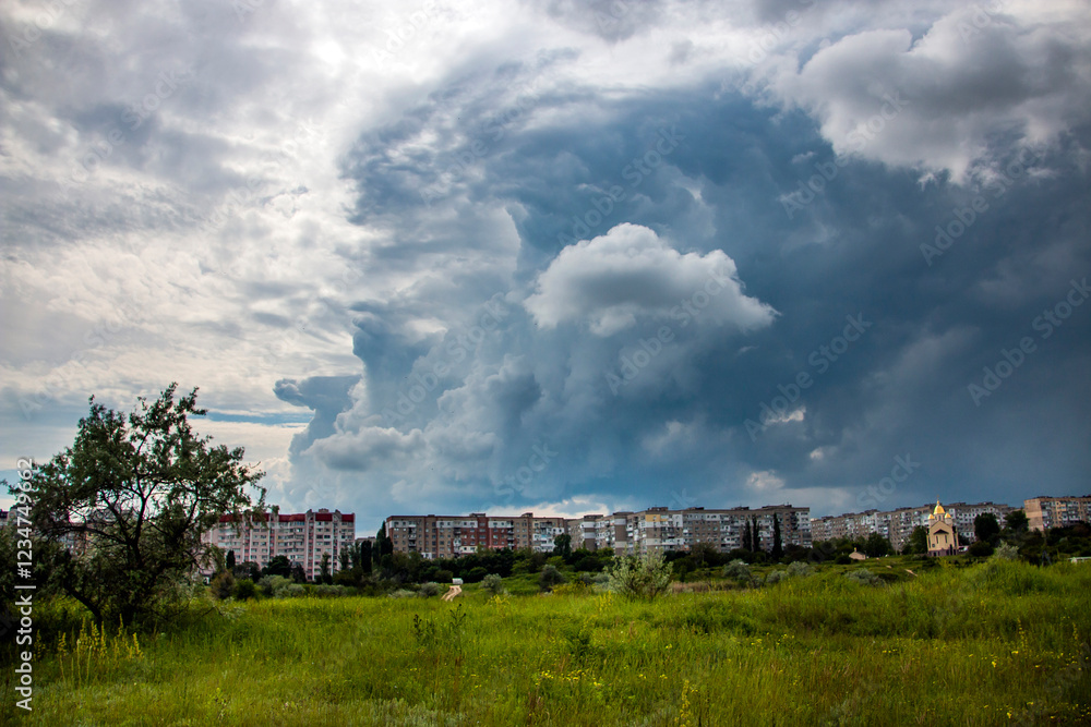 Thick, gloomy clouds cover the city in summer
Thick, gloomy clouds cover the city in summer
