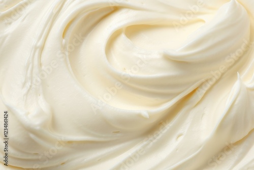 Smooth, creamy buttercream frosting swirls together, creating a delectable texture perfect for cakes and desserts