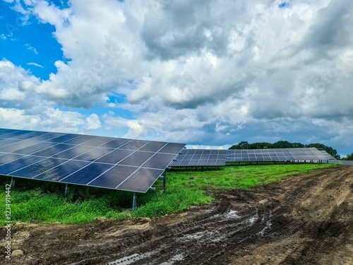 Solar panels providing sustainable energy under cloudy sky photo