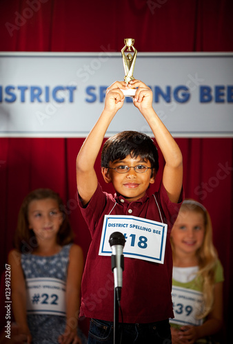 Spelling: Boy Excited to Win Trophy