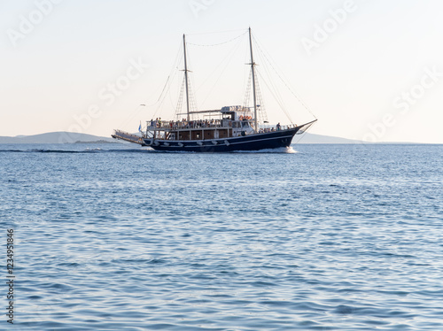 A sunset cruise ship tour on the island of Mykonos in Greece photo