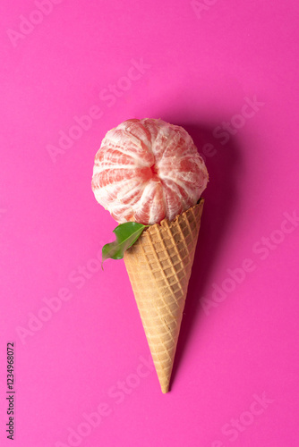 Obraz na płótnie Grapefruit Ice Cream in a Cone on Pink Background w salonie