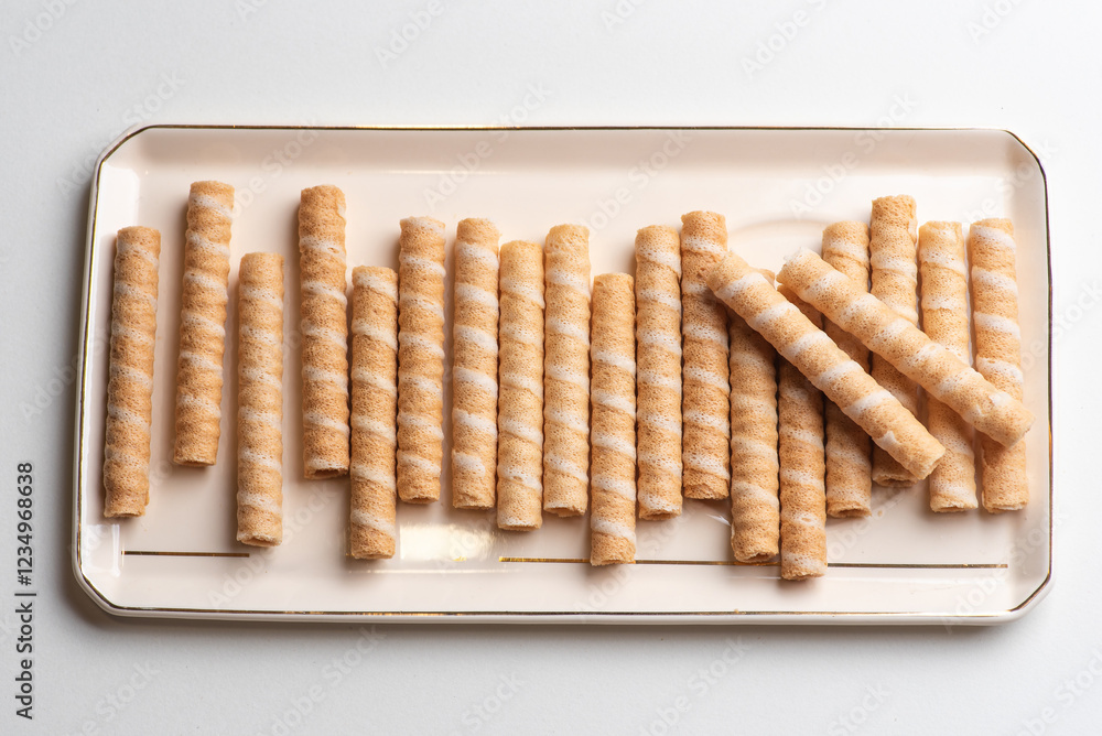 Crunchy Rolled Wafer Sticks on Elegant Tray