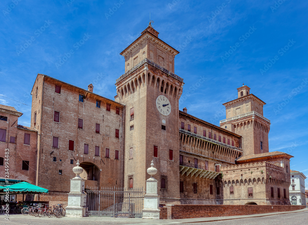 The historic Costello Estense, a medieval defensive structure in Ferrara under clear blue skies