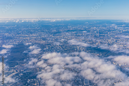 view from an airplane of clouds over the city of Moscow, Russia