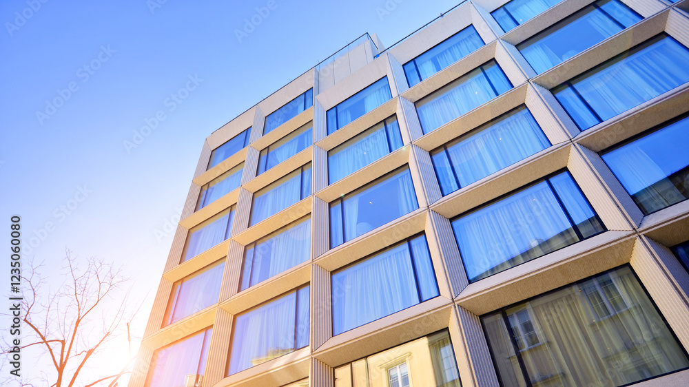 Large glass windows in a modern hotel building. Modern urban architecture. Large expanses of glass in concrete wall panels. Large glass windows in a modern hotel building. Modern urban architecture. Large expanses of glass in concrete wall panels.