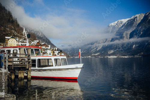 Yacht on a mountain lake with incredible scenery around