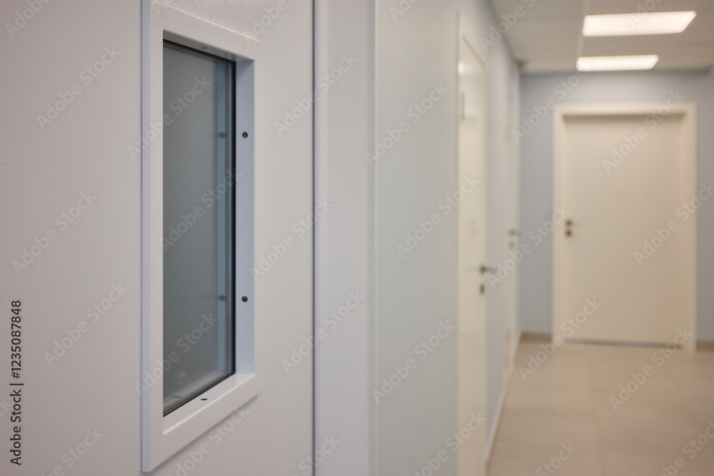 Fototapeta premium A White Door with a Window in a Contemporary Interior, Exuding Elegance and Style