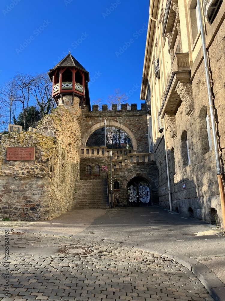 Medieval Stone Gateway with Tower and Cobblestone Path Medieval Stone Gateway with Tower and Cobblestone Path