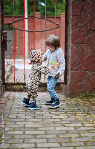 Portrait of two siblings having fun outdoor photo