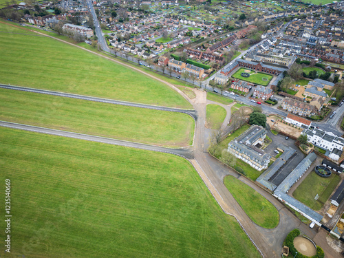 Aerial view of the start of the Newmarket training gallops seen adjacent to horse racing stables. Private apartments are located nearby, overlooking the famous Gallops. photo