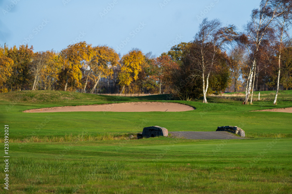 Bunker in a green golf course at fall. Bunker in a green golf course at fall.